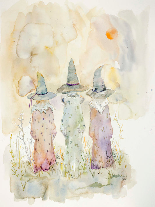 Watercolor Painting of three cloaked witches walking beneath a twilight sky. The figures are silhouetted in soft hues, evoking folklore, mystery, and ancient magic. A moon glows faintly above the horizon.