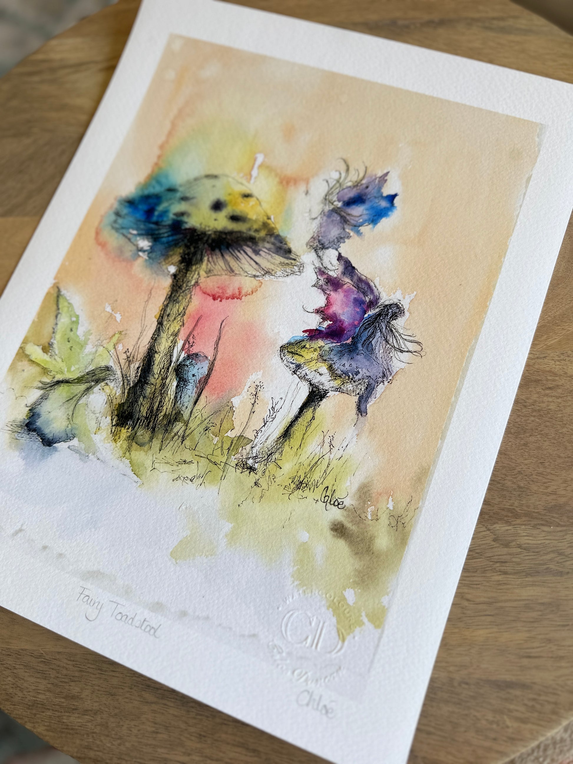 Watercolor painting of a single toadstool nestles in soft moss glowing faintly with a dreamlike light. A quiet, magical scene by Scottish artist Chloe Duncan, known for her gentle, folklore inspired nature at.